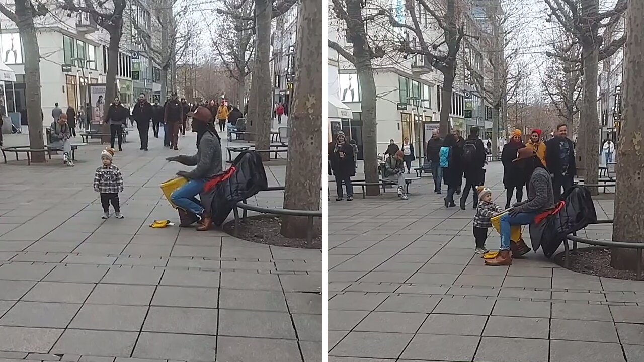 Toddler Grooves To The Beat Of Street Drummer's Performance