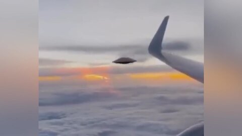 UFO Releases Black Smoke near Plane