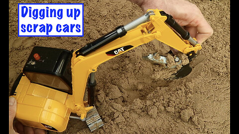 Digging up scrap cars