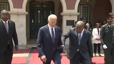 President Joe Biden Looks As Confused As Usual In Angola… Being Led Around Like A Child