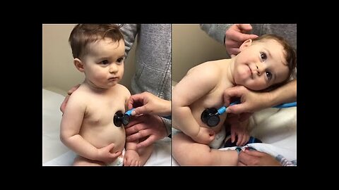 Sweet Baby Boy Rests Head On Nurse's Hand During Check-up