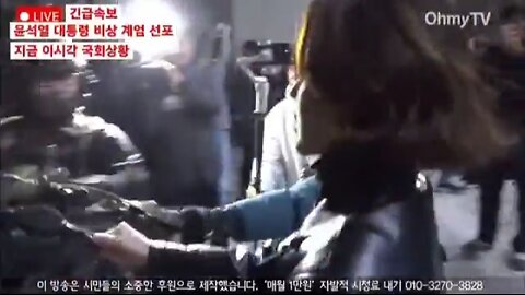 #Seoul #Korea Woman tries to steal a rifle from a soldier.