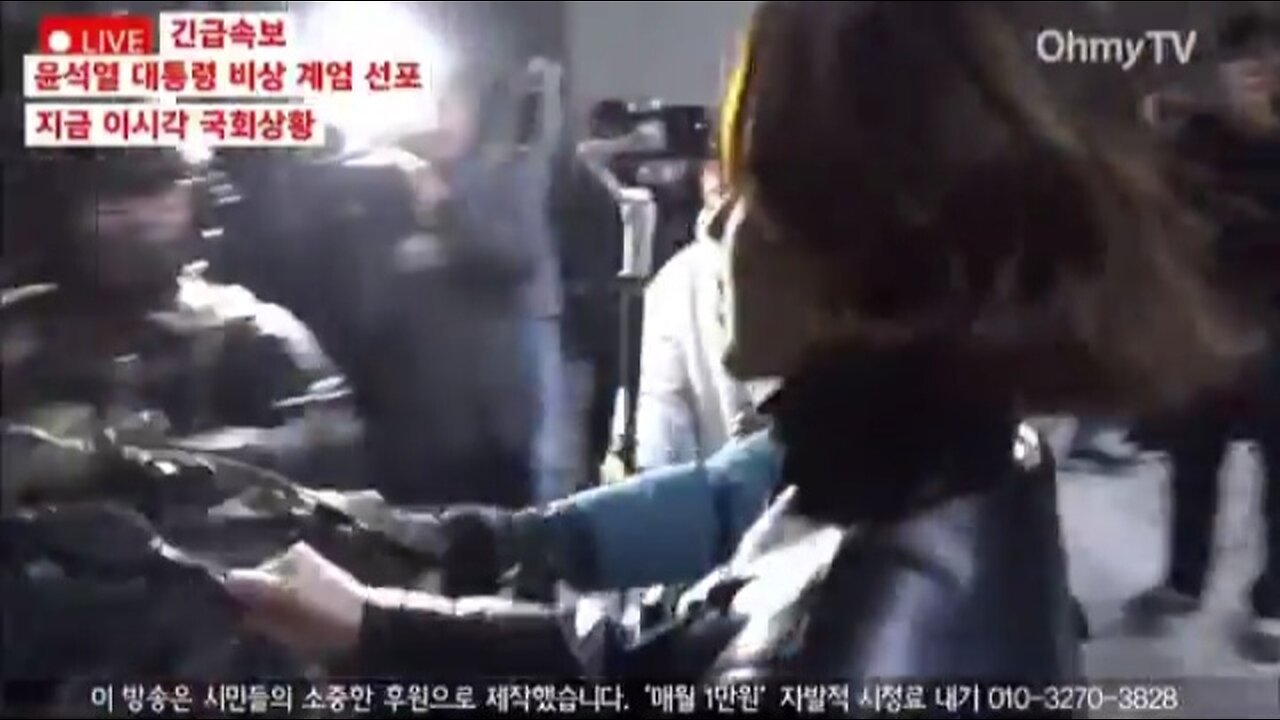 #Seoul #Korea Woman tries to steal a rifle from a soldier.