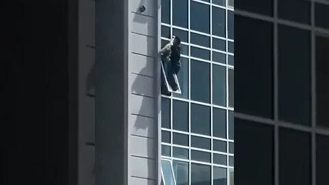 Guy climbs apartment to save a girl from falling