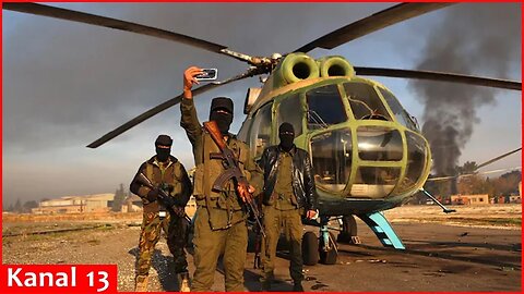 Syrian insurgents in Aleppo International airport as they seize Syria's largest city of Aleppo