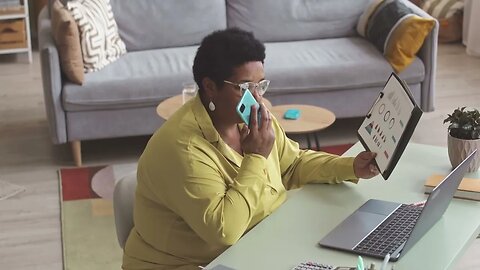 african american mature businesswoman analyzing financial charts and graphs while w SBV 347405780 HD