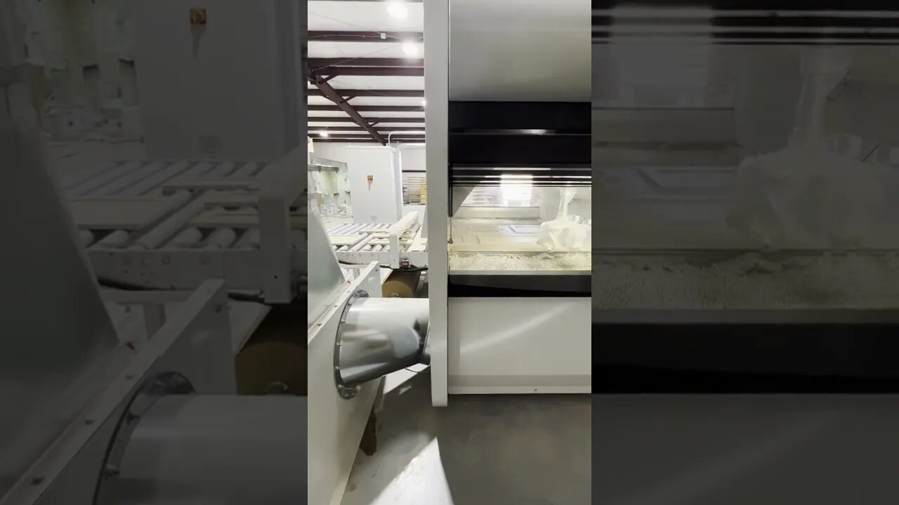 Painting doors white with our automated paint machine