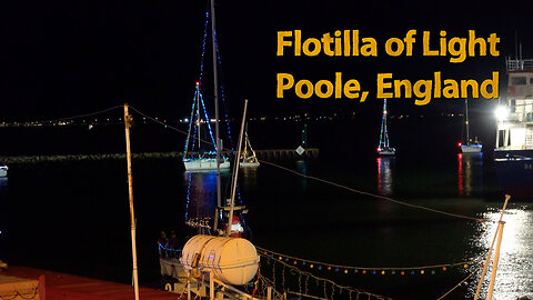 Flotilla of light, boats in Poole Harbour covered in Christmas lights