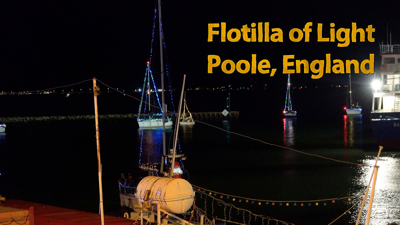 Flotilla of light, boats in Poole Harbour covered in Christmas lights