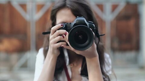 woman with camera on the street SBV 307294883 HD