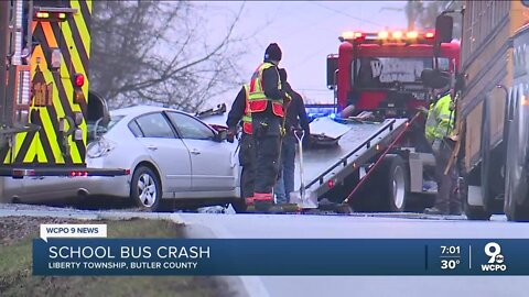 Driver hospitalized after crash involving school bus