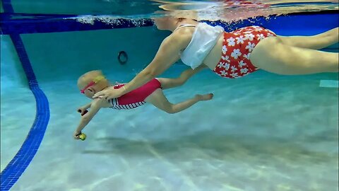 Mom and Daughter Underwater