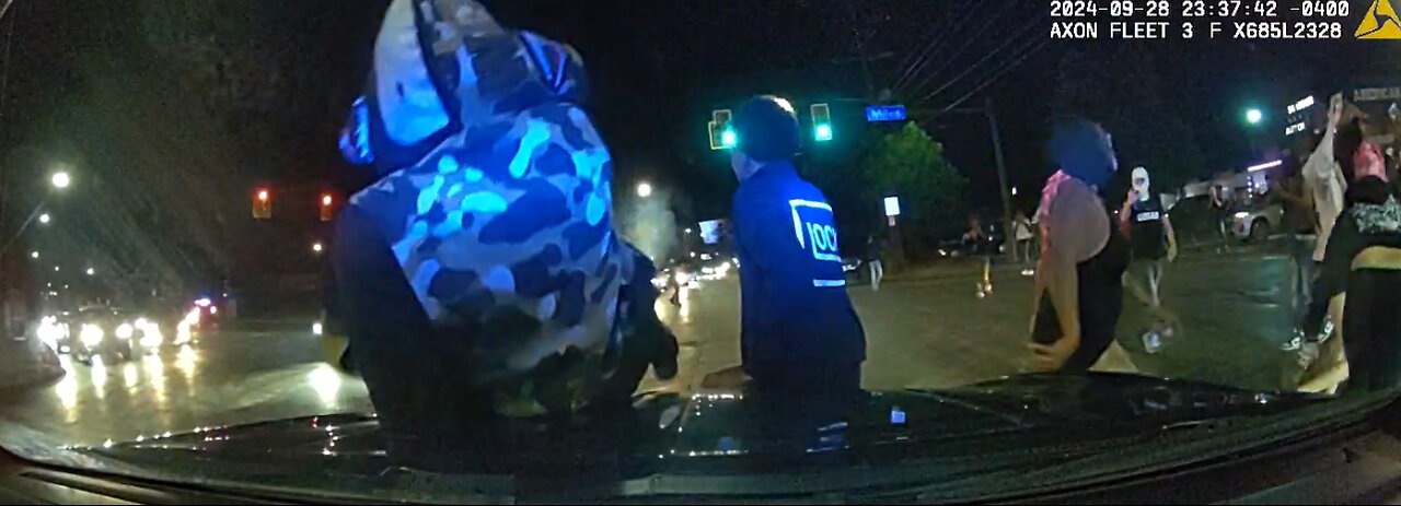 Misguided youth take over Cleveland Ohio Street , Donuts around cop car