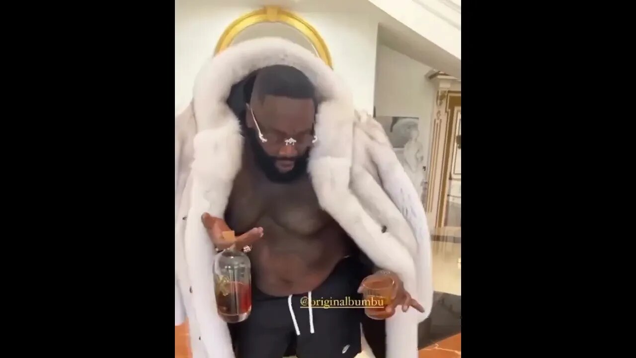 Rick Ross Dance Around In His Fur Coat with bottle of Bumbu in hand