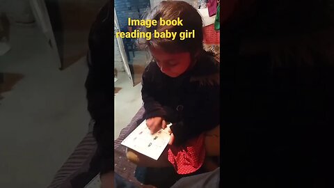 Sweet voice of book reading by baby girl