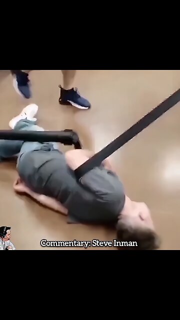 A man helps another customer checkout in line