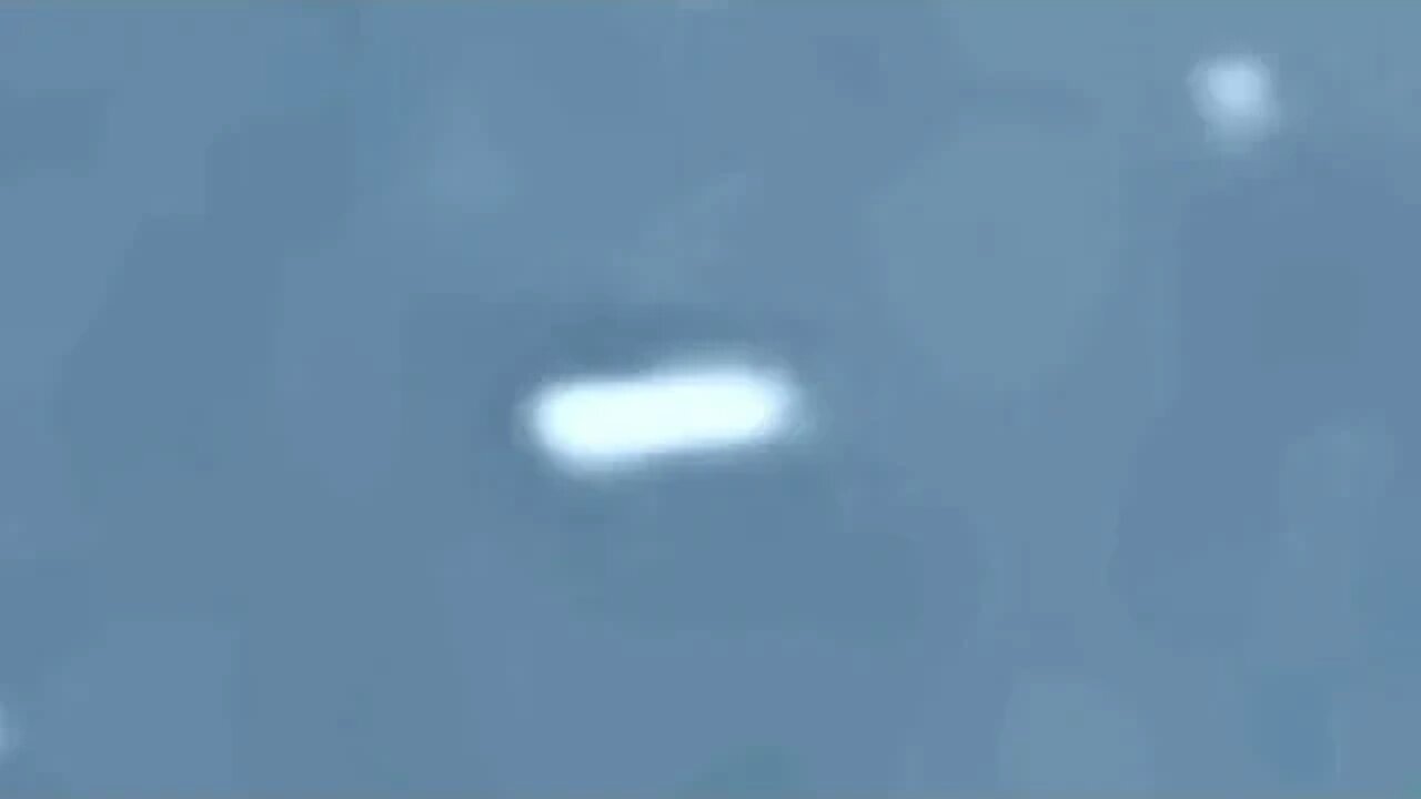 small pulsing UFO with dramatic looping UFO flyover