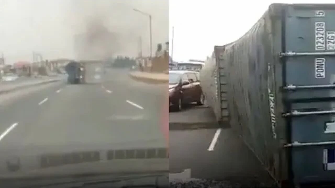 The scary moment a container laden truck fell on a road in Dopemu, Lagos