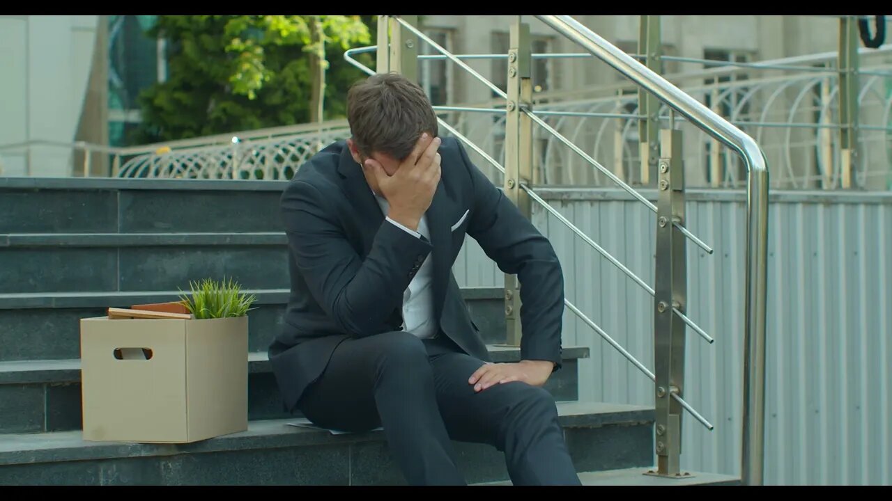 businessman sitting on stairs near office center with carton box and documents with SBV 338480818 HD