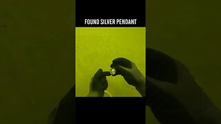I found a Silver Necklace pendant in the river treasure hunting