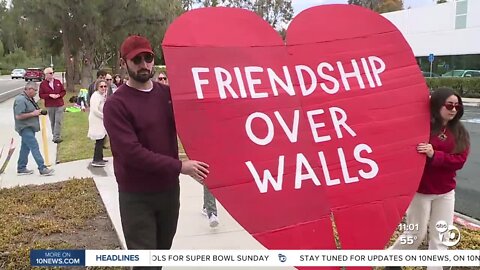 Activists march in Chula Vista for the reopening of Friendship Park