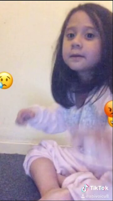 Two baby girls being cute