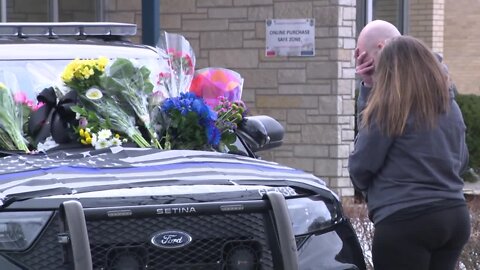 Community pays respect after officer is shot and killed