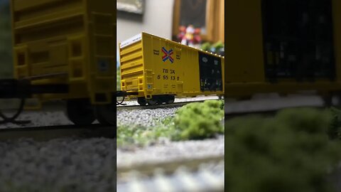 N scale heavy manifest pulling a hill. Cool sound