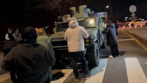 People block military vehicle trying to leave area near South Korea's parliament