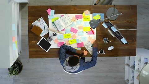 top view of creative young entrepreneur using desktop computer and writing messages SBV 338002734 HD