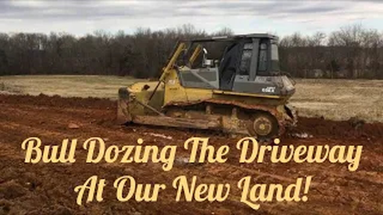 Land improvements begin! Komatsu Dozer pushes dirt and trees to make way for a new driveway