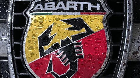 Abarth 595c Turismo MTA. Modern convertible Vs. caught in the Rain