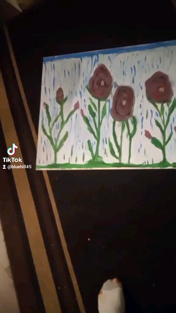 roses in front of a waterfall