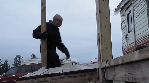 Expanding on the reclaimed wood porch at the off grid homestead