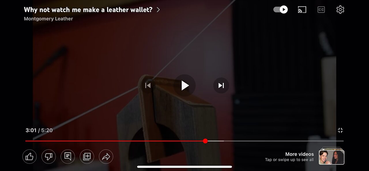 Sewing a leather wallet.