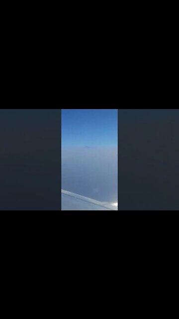 Beautiful! Flying past Mount Teide peeking out through the clouds!