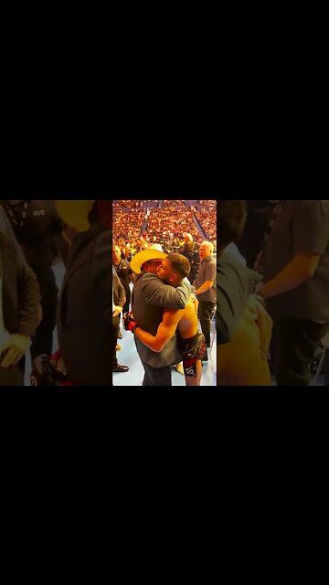 Following his interim featherweight championship victory, Yair hugs his family.