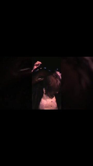 Cari Dell playing guitar Jimi Hendrix style