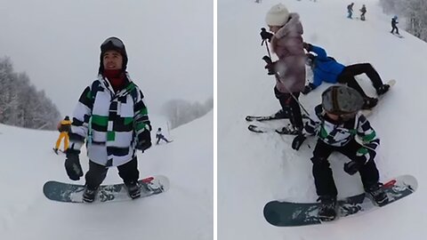 Heroic snowboarder leaps into action to save falling little girl