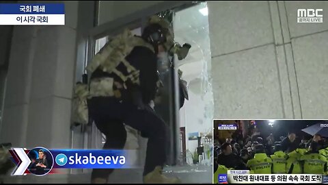 South Korean special forces break into the parliament building & arrest lawmakers under martial law.