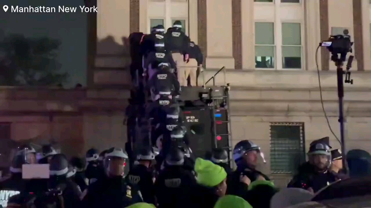 NYPD officers in riot gear entered through second-floor window to remove anti-Israel agitators.