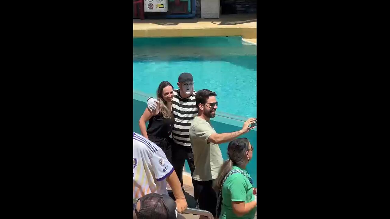 Tom clicking pictures with couple