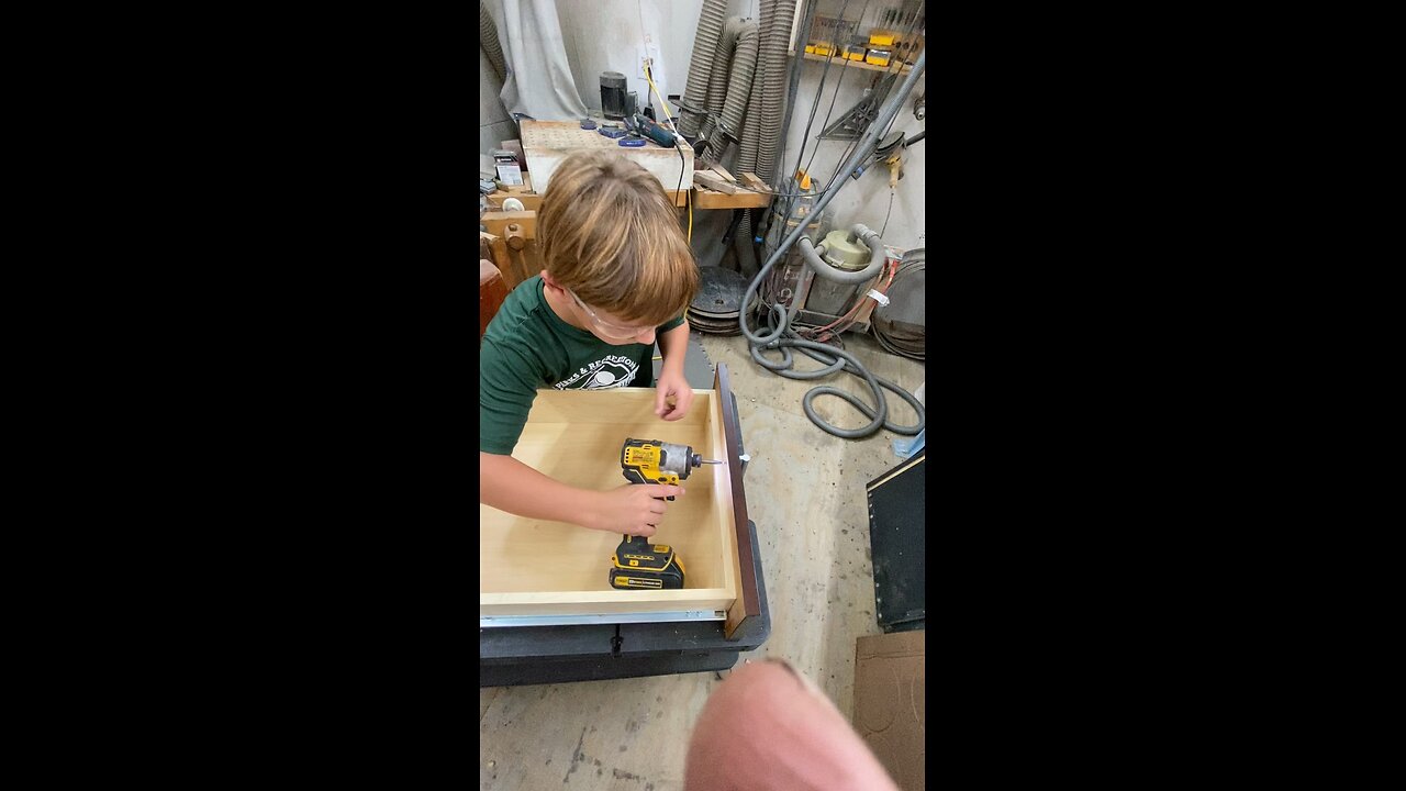 Teaching an 8 year old how to use power tools.