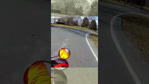 Near miss. Driver cuts corner and nearly hits motorcyclist