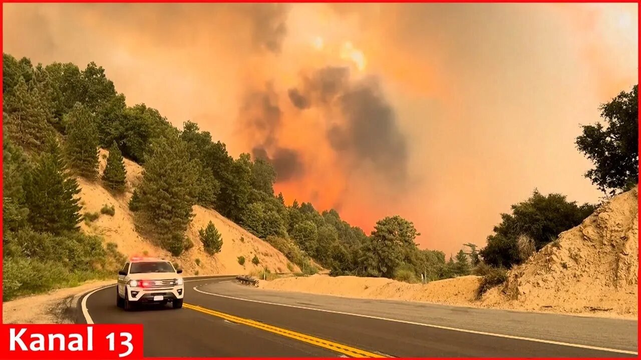 Wildfire east of LA threatens tens of thousands of homes and forces evacuations