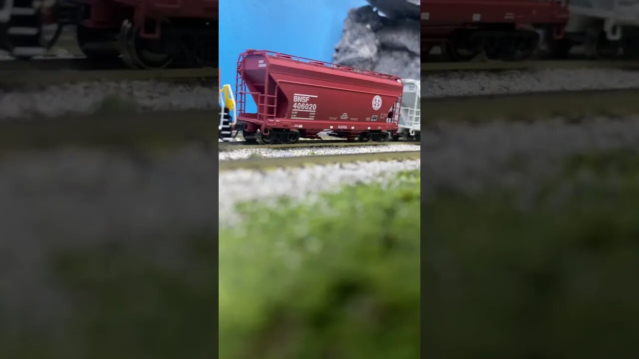 N Scale Gevos run 8 starting up a hill.