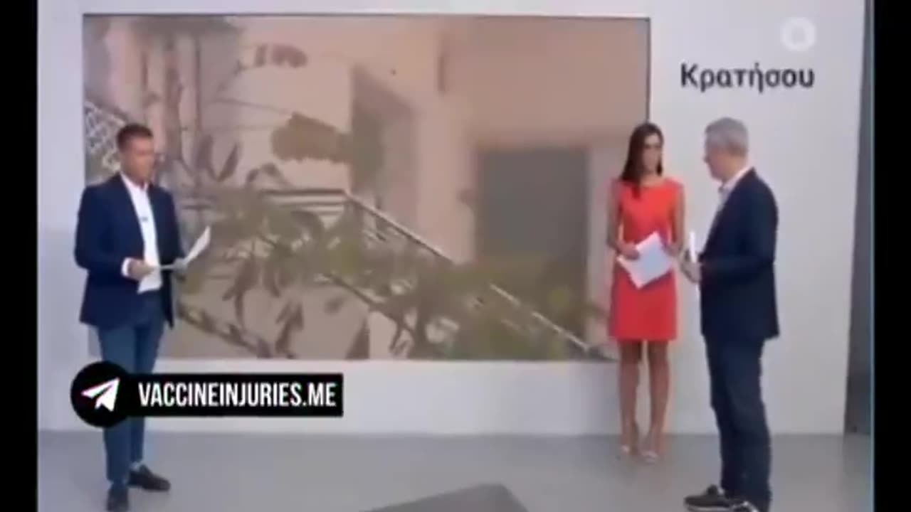 Greek TV presenter does a 'Pfizer' live on air...