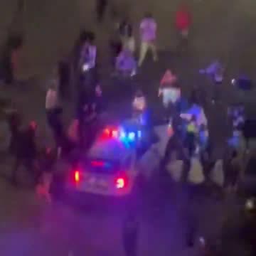 Philadelphia police office viciously attacked by violent crowd while sitting in his patrol car,