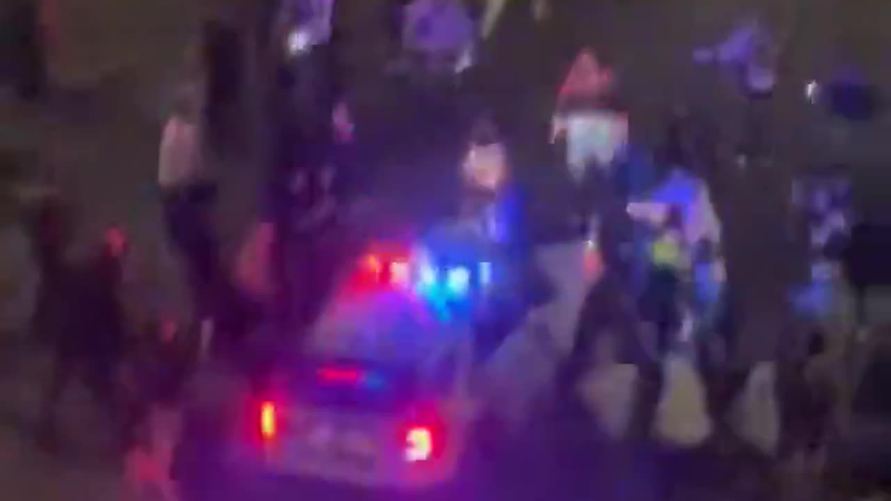 Philadelphia police office viciously attacked by violent crowd while sitting in his patrol car,