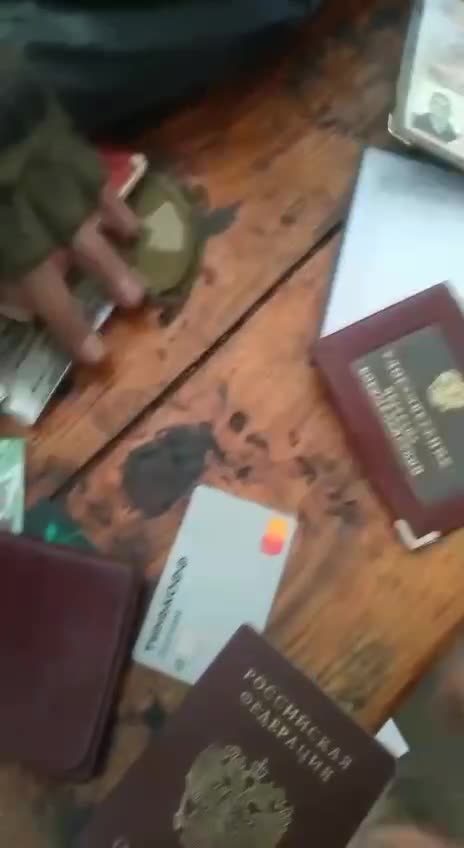 Going through Documents Found in an Abandoned Home Russians Had Occupied